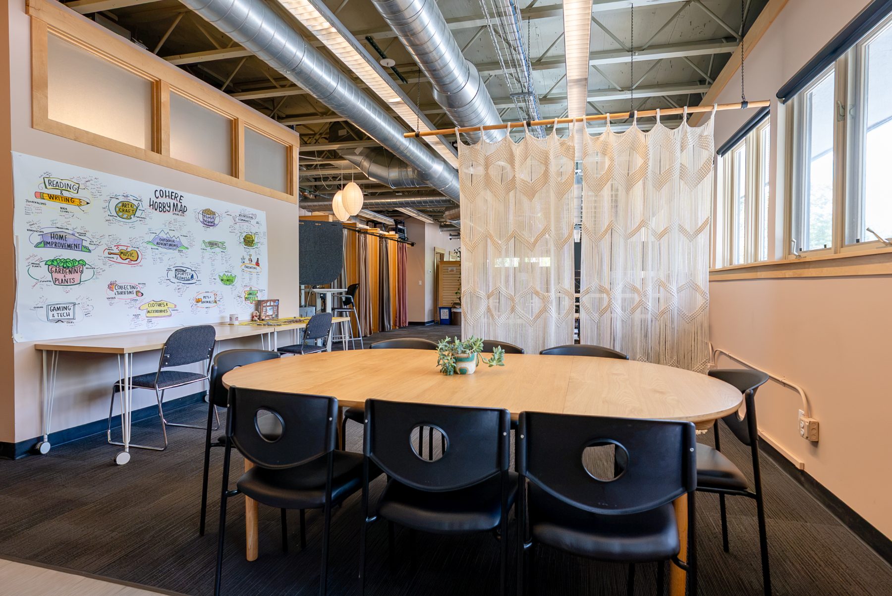 Shared dining table under macramé